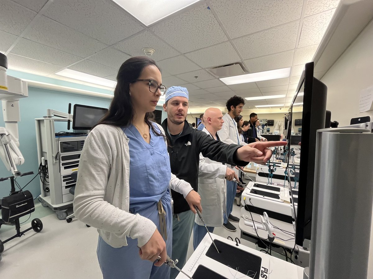 HMSurgery's tweet photo. APD Dr. Tariq giving our junior residents tips for Fundamentals of Laparoscopy (FLS). Our Inanimate Skills Lab (ISL) with laparoscopic &amp; robotic trainers is located right next to our resident work space &amp; accessible 24/7! https://t.co/shK9UWWTfZ