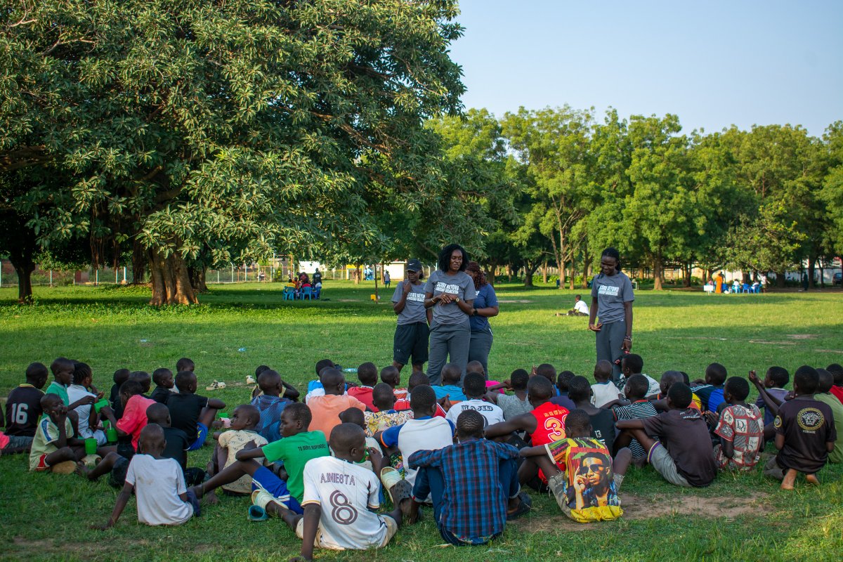 score_beyond's tweet image. In Adjumani, home to the Best Barefoot League in the World, our team at Score Beyond gathers with a circle of children to share stories, lessons and encouragement.

#ScoreBeyond #BarefootLeague #SportsForDevelopment #YouthEmpowerment #CommunityImpact