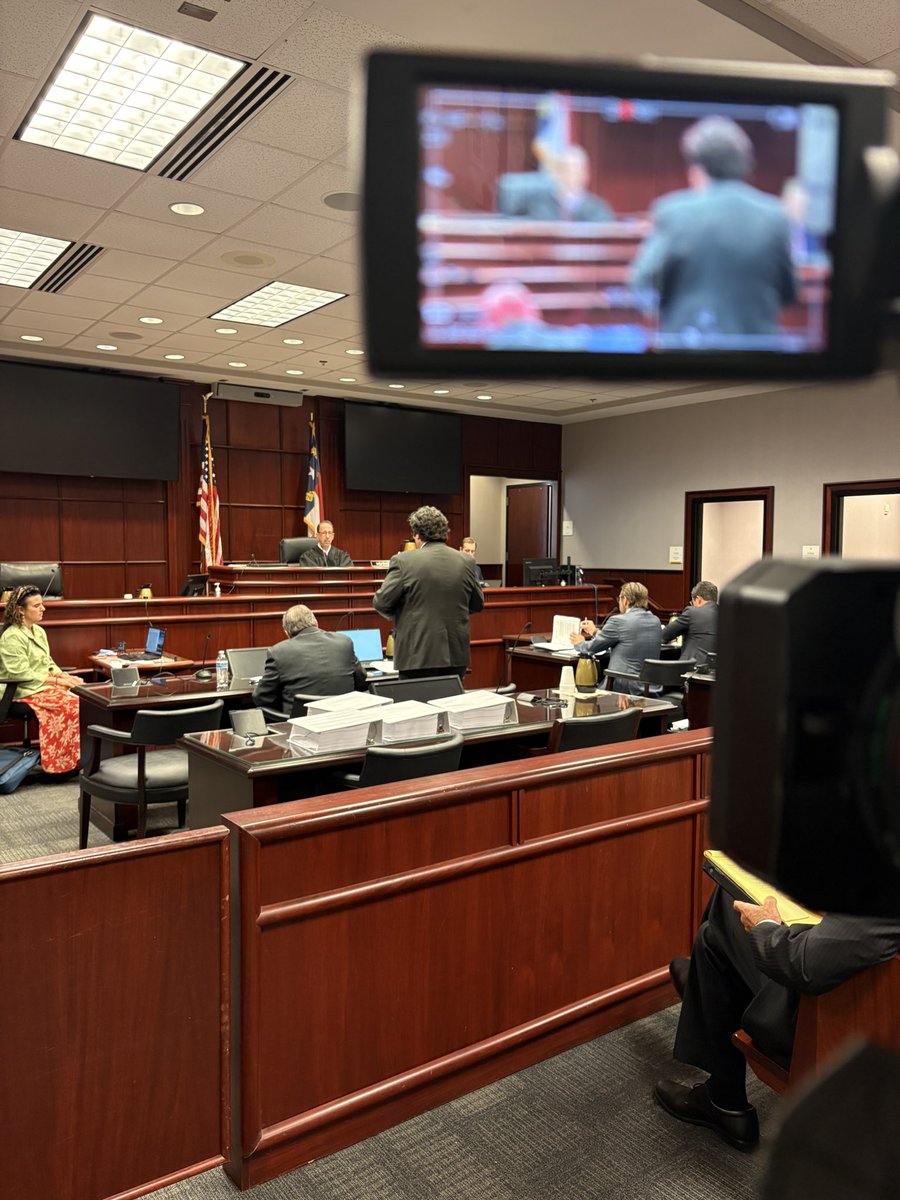 thatreporter's tweet photo. Happening now: A North Carolina judge is hearing Duke Energy’s motion to dismiss Carrboro’s climate deception lawsuit. The town says Duke misled the public about fossil fuels. Duke says federal law preempts the case. https://t.co/9WGyBPi3vA #ncpol #climate https://t.co/gRuKbSqqtK