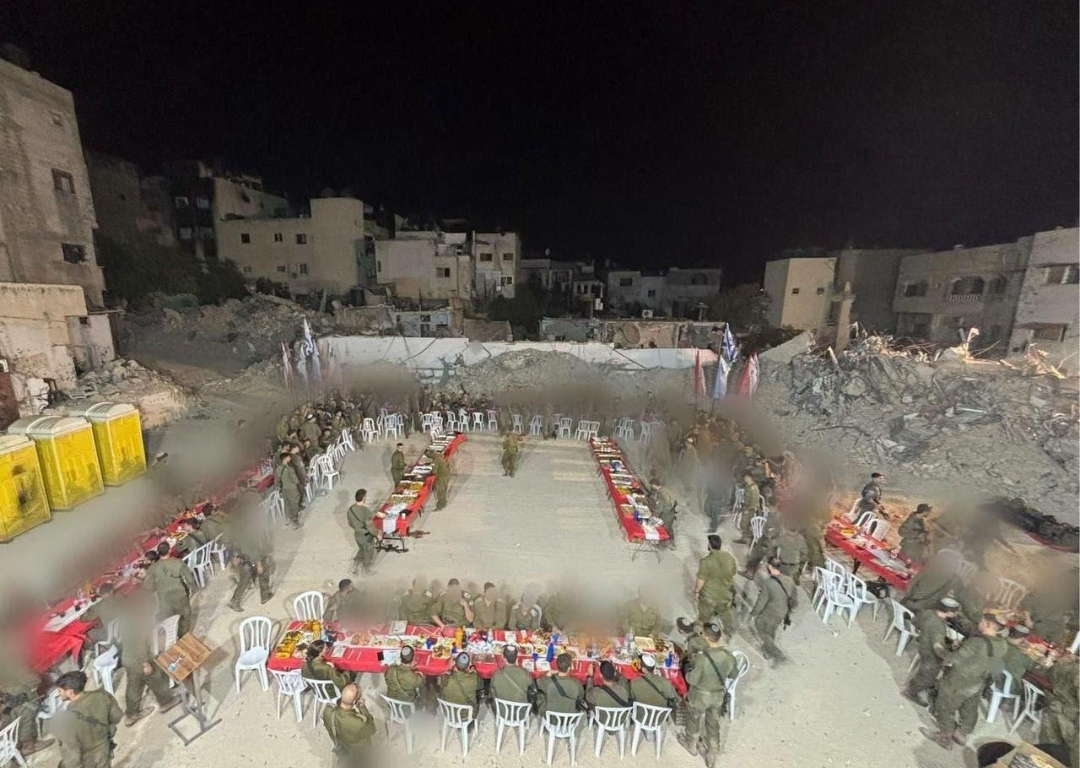 Israeli soldiers celebrate Rosh Hashanah, or the Jewish New Year, in the ruins of the Jenin Refugee camp that they are in the process of wiping off the map.