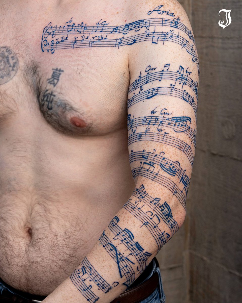 Inkedmag's tweet image. We’re in awe of how @oozy_tattoo brought Bach’s Goldberg Variations, Aria, to life in ink. 🤩💙⁠
