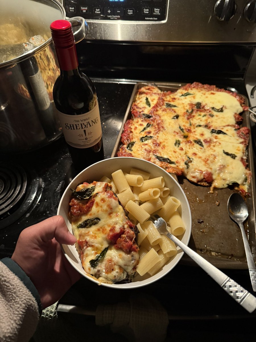 eggplant parmesan. homemade tomato sauce, fried eggplant, mozzarella, and fresh basil.