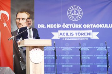 Students in white shirts and black pants holding Turkish flags, standing with a man in a suit. A large banner reads "Dr. Necip Öztürk Ortaokulu Açılış Töreni 28 Eylül 2023 / Adıyaman." A man in a suit speaks at a podium with microphones, flanked by Turkish flags and a banner featuring a portrait. People in suits and children sit at desks with flowers and balloons. Individuals in suits sit around a table in a meeting room.
