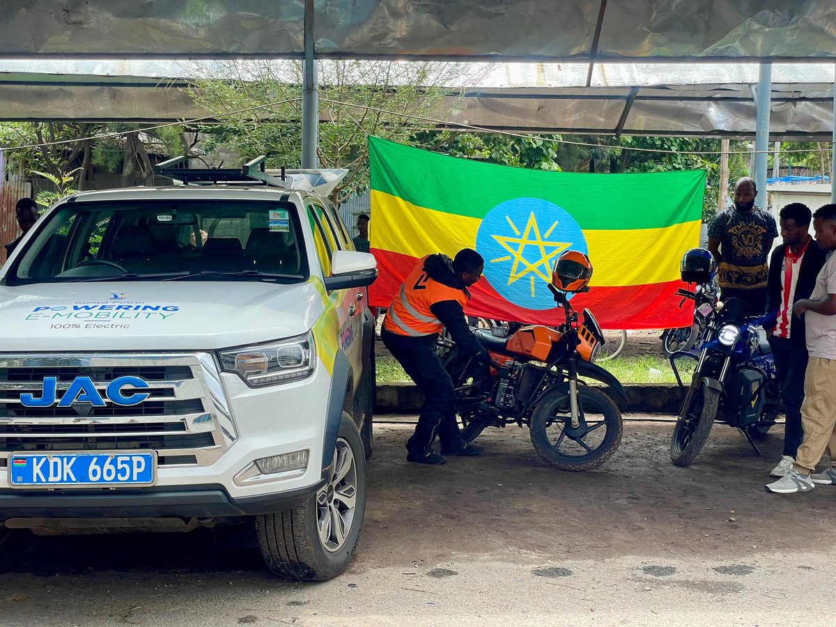 KenyaPower's tweet photo. It's day 7 of #RoadtoAddis, the science of the stop.
1134 hrs: Setting up for a top-up charge at the Ethiopian Electric Utility premises in Hawassa, Sidama Region. We're now just 270 kilometres from Addis Ababa, with Ziway as our next stop.

Charging has been as much a part of this journey as movement itself. Every pause has been a chance to refuel and recalibrate. Along the way, we've come to appreciate the two faces of electric charging: AC and DC.

Alternate Current (AC) charging takes longer but demands little in terms of infrastructure. It's ideal for domestic use and, more importantly, kinder to the battery over time. 

Direct Current (DC), on the other hand, delivers power much faster, making it perfect for vehicles in transit and commercial operations. Each mode plays its role in the rhythm of electric travel: one for patience, the other for pace.

Every stop on the Road to Addis reminds us that the journey isn't just about covering distance. The cross-border journey has been focused on mastering the balance between speed and moving deliberately towards what lies ahead.  #PoweringEMobilityKE #TheFutureIsElectric #PoweringKenya #AEW2025 ^KN