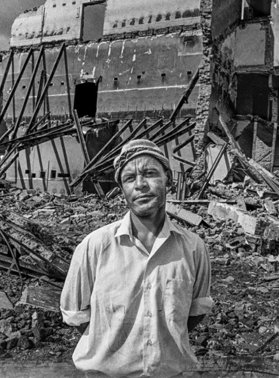 HistorySAZAR's tweet image. Man watching the demolition of his cinema, District Six, Cape Town, 1974. District Six, an area adjacent to Cape Town’s central business district, was a vibrant racially diverse community. Due to its convenient proximity to the city centre, the authorities reclassified it as a…