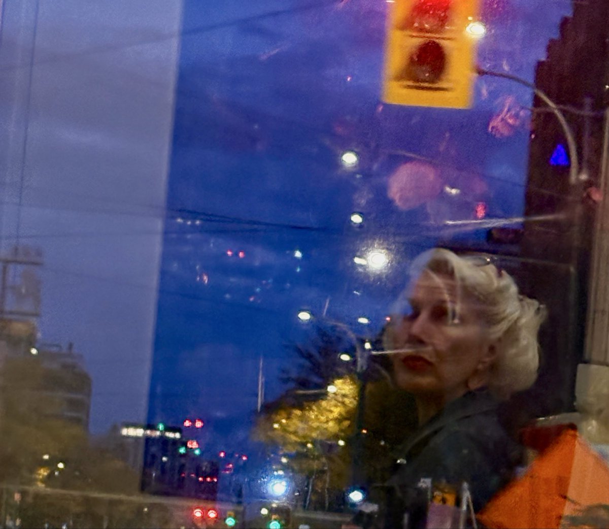 Fun with reflections on a streetcar ride at dawn.