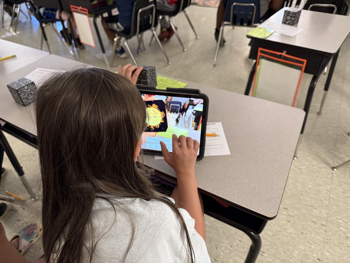 swampfrogfirst's tweet image. These @oesrams third graders had a great time exploring the solar system using @mergeedu cubes. 
They’re working were challenged to use the information part of the app to fill out a planet form🙌🏻 as they explored. 

#MergePizzaParty 
#edtechcoach