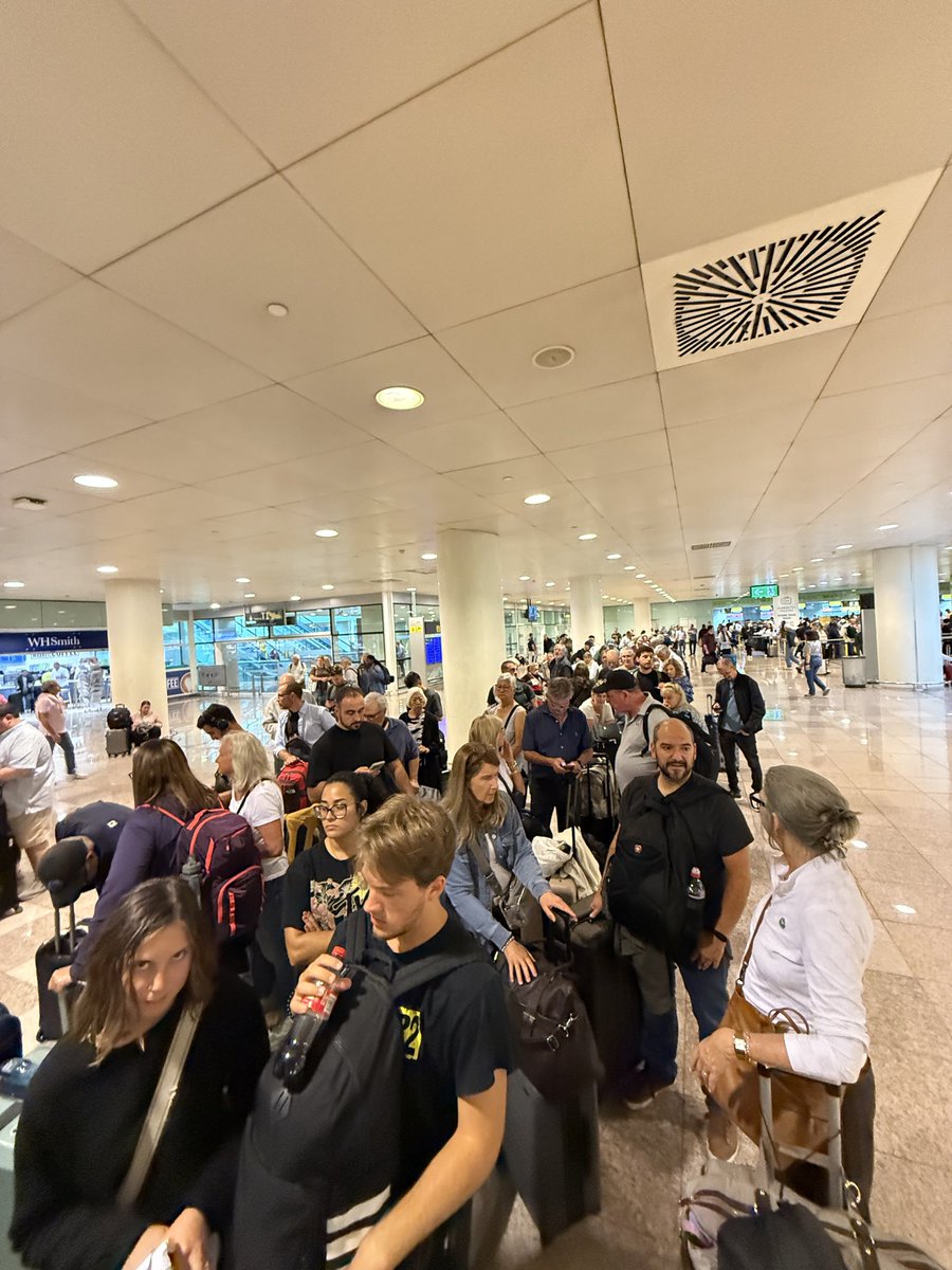adam_kinsinger's tweet photo. @Delta you’ve completely ruined our honeymoon and the trips of all of these people. We’ve been told that hotels and transportation would be booked after a cancelled flight, and our line hasn’t moved an inch in over two hours. Shame on you. https://t.co/j6e3BHMqNx