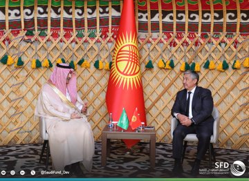 First image shows two men standing side by side in traditional Kyrgyz yurt setting with decorative wall hangings, red Kyrgyz flag with sun emblem, Saudi flag, and green flag; one man in white thobe and red checkered headscarf holds green folder with Saudi Fund for Development logo, the other in dark suit holds red folder, both smiling formally. Second image depicts the same two men seated facing each other across a low table with water bottles and flags including Saudi, Kyrgyz, and another green flag, in similar yurt interior with embroidered decorations and chairs. Third image features six men standing in group pose in the yurt with ornate green and red wall panels, central tall red Kyrgyz flag, various flags on table, men in suits and traditional attire including thobes, all positioned formally around furniture.