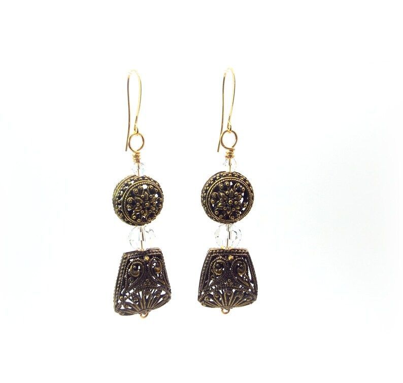 Beautiful Crystal and Bronze Earrings – Bronze Filigree and Clear Crystal #Earrings by #DesignedbyAudrey.  Lovely women's #handmade jewelry and accessories buff.ly/3VGnSvG via <a href="/Etsy/">Etsy</a>