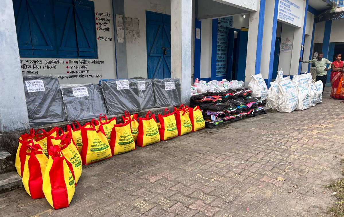 Distribution of relef materials to the flood affected families <a href="/egiye_bangla/">Egiye Bangla</a> <a href="/DMCoochbehar/">DM CoochBehar</a> <a href="/sdotufanganj/">SDO Tufanganj</a> <a href="/GoWestBengal/">Government of West Bengal</a>