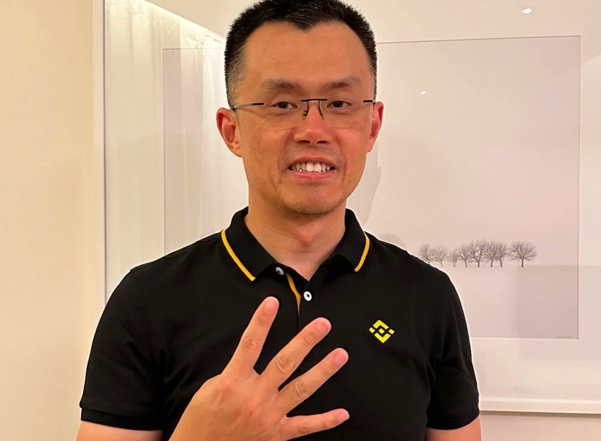 CZ from Binance signaling with hand gesture