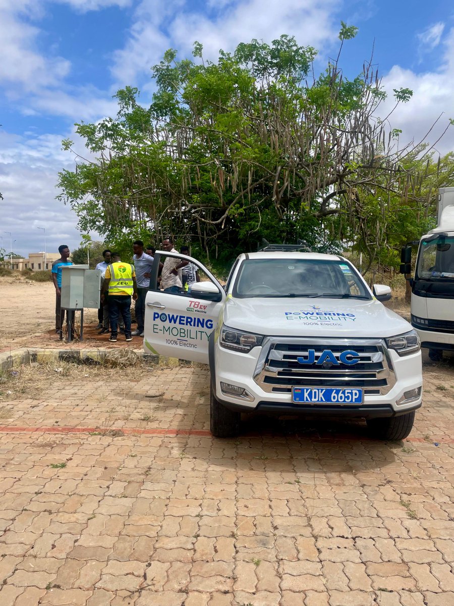 KenyaPower's tweet photo. Day 5 of #RoadtoAddis: Passing the Baton
1051 hrs: After a hearty breakfast of shiro and anjera, we made our way to the Moyale Customs Holding Area in Tilemado, our first charging stop on Ethiopian soil. This session, and all those ahead, are being facilitated by the Ethiopian Electric Utility (EEU), to whom Kenya Power has officially passed the baton. The collaboration marks a smooth handover of power and purpose as the convoy continues its electric ascent toward Addis Ababa.

Our trusty electric steed for the Road to Addis, the JAC T8 EV Double Cab, is a sturdy electric workhorse built for endurance. Its 65 kWh battery delivers up to 300 km on a full charge, while its fast-charging capability of 50 kW can add more than 100 km of range in just half an hour. Beneath its quiet hum lies real muscle: the JAC T8 EV can easily haul several tonnes.
It’s one of 11 electric vehicles in the Company’s growing e-fleet, including 35 motorcycles and 3 forklifts. Together, they’re rewriting what efficiency looks like, running at an average cost of about KSh 4 per kilometre.

As the fleet grows, so does the vision. The Company is now rolling out charging infrastructure nationwide, with Nyeri set as the next stop, a move designed to power its operations and the town’s matatu sector, which is steadily embracing electric mobility. #PoweringEMobilityKE #TheFutureIsElectric #PoweringKenya #eMobility #AEW2025 ^KN