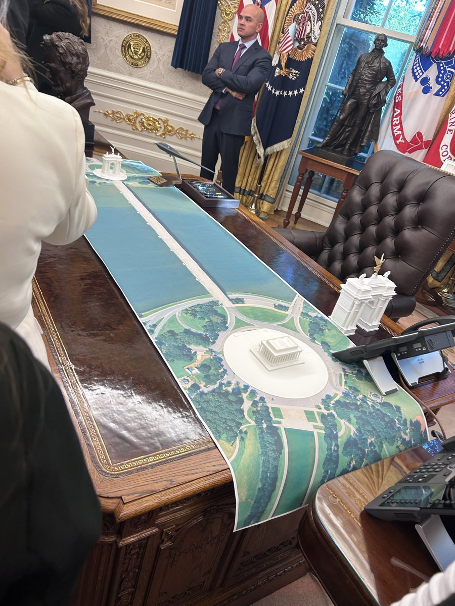 WallStreetMav's tweet photo. BREAKING: On his desk in the Oval Office today, President Trump had a 3D model for a Triumphal Arch on the National Mall. 👀 https://t.co/fB12oiLApt