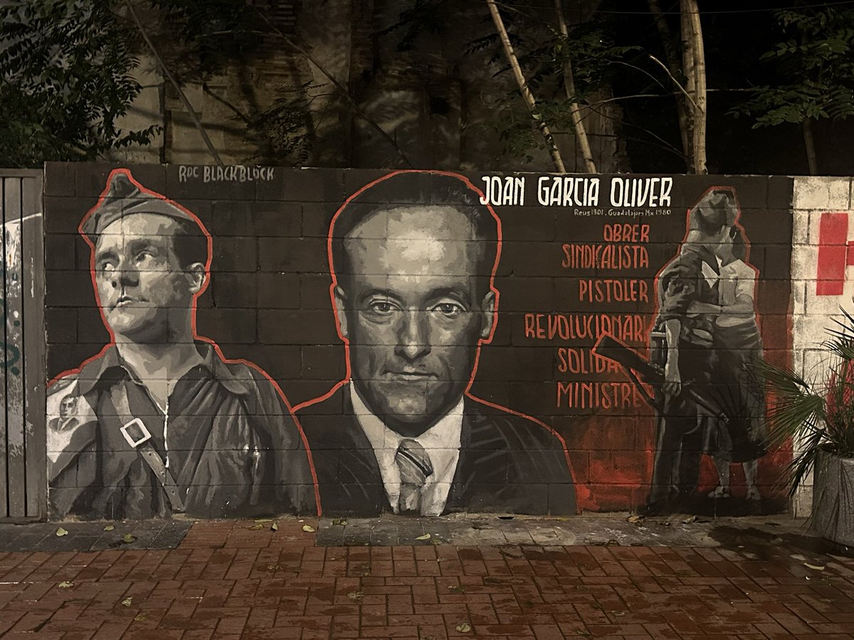xaviguix's tweet photo. ✊ Avui s’ha inaugurat l’obra de Roc Blackblock dedicada a Joan Garcia Oliver davant el local de la Bullanga.
🗣️ Joan Navais ha completat la jornada amb una xerrada sobre “el rei de la pistola obrera”. https://t.co/CIPsO5uYkW