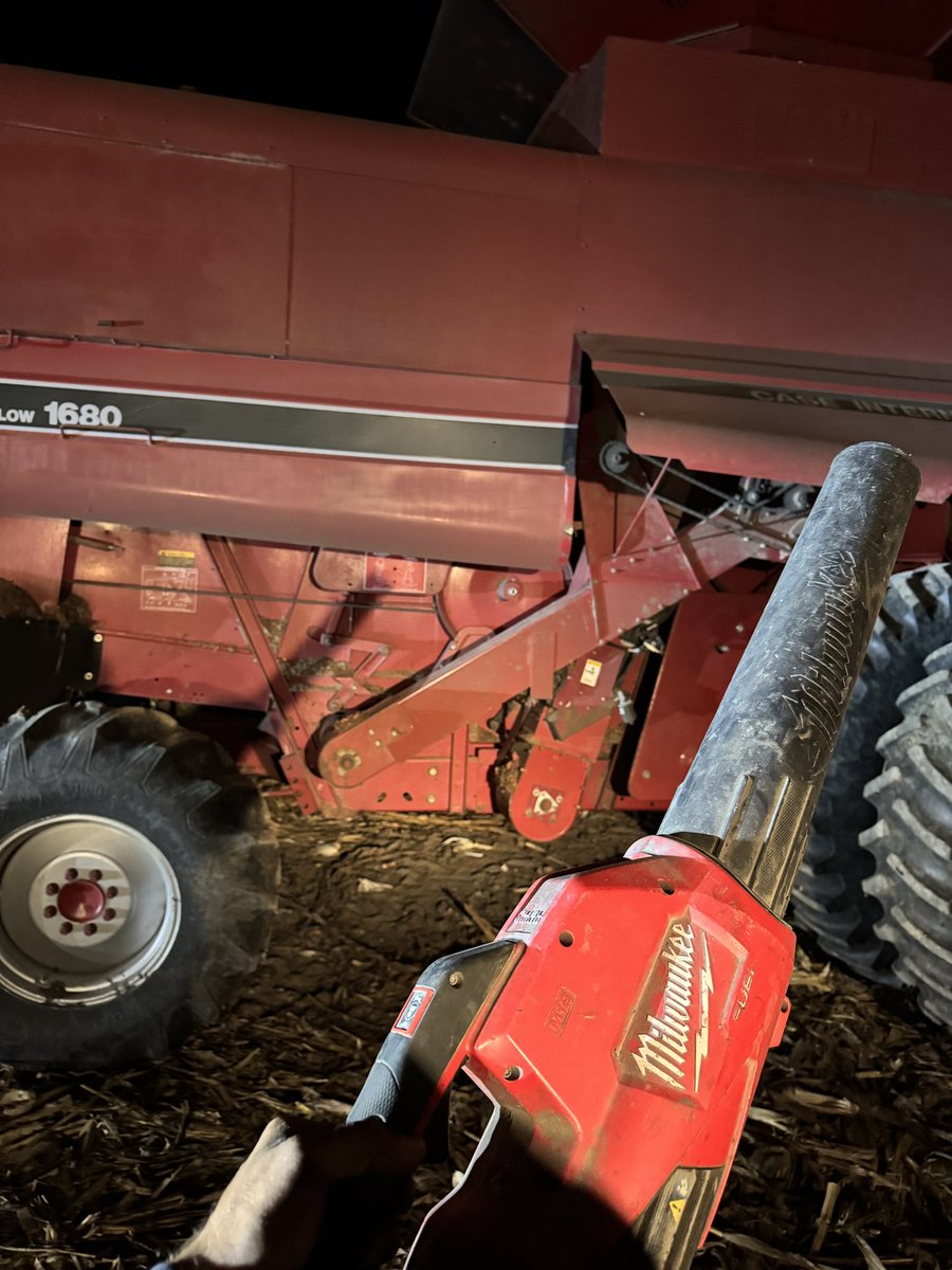 Clean equipment is happy equipment. 

I’m team leaf blower and grease gun at the end of the night. Nothing wrong with morning time, but I prefer not to wear that dust in the cab all day. 

Plus inspecting the machine at night gives you the chance to be first in line at the parts