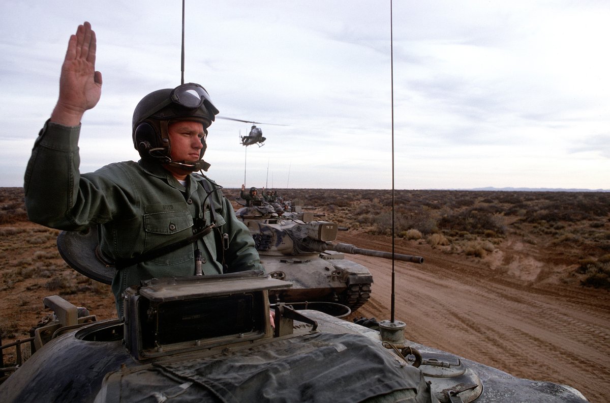 Who Likes tanks &amp; choppers?
U.S. Army soldiers give hand signals from the turrets of their M-60 main battle tanks during a field training exercise. An AH-1 Cobra helicopter is hovering overhead NAID: 6399294 
Local ID: 330-CFD-DA-ST-86-09461.
Produced: May 1, 1975