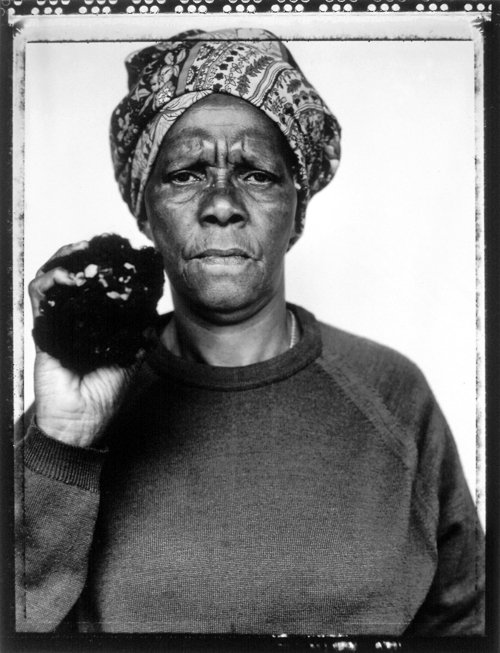 Joyce Mtimkulu holding a piece of her late son, Siphiwo's hair, that had fallen out after he was poisoned by security police in 1981. A year later he was kidnapped, drugged, shot execution-style and burned on a wood pyre at the age of 22, as revealed by security police at the