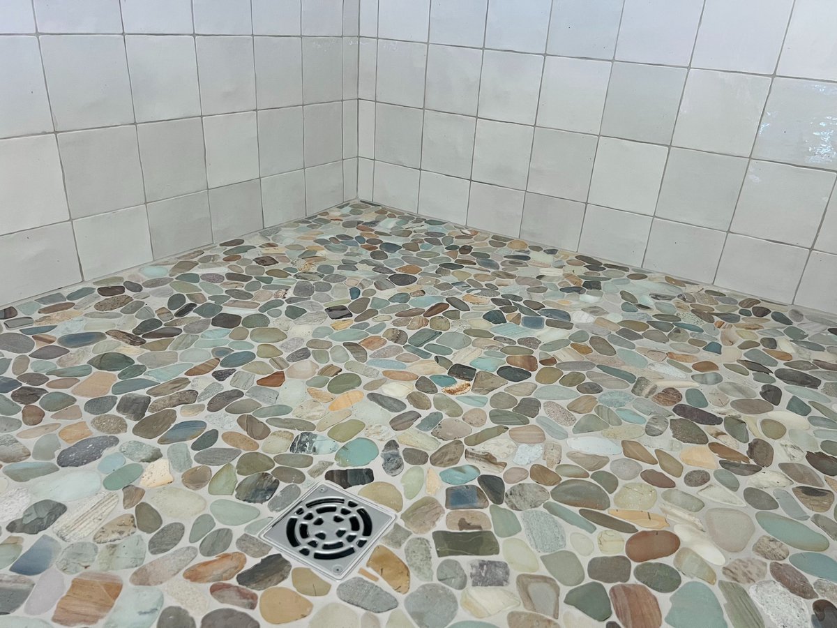 A natural stone tiled shower that feels like stepping into a mountain stream — refined, natural, and sustainable. 🌿 #GreenBuilding #LuxuryLiving

👉 brockbuildersinc.com