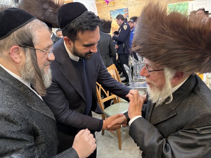 First image shows a group of men in traditional Jewish attire including fur hats sidelocks and long coats standing outdoors on a sunny day near brownstone buildings and construction with some children present engaging in conversation. Second image depicts a gathering inside a sukkah with leafy branch roof holiday garlands and tables set with food like salads fruits bread and drinks surrounded by men in similar traditional clothing discussing animatedly. Third image captures three men one in a suit and two in traditional hats shaking hands near wooden chairs and balloons in an indoor setting with plants and festive elements.