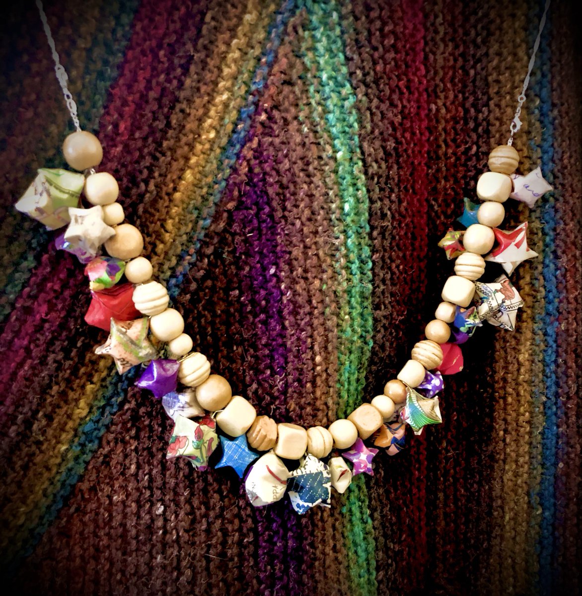 This starry necklace includes beautiful paper from #Florence #Italy, letters from friends, Grandparents &amp; maps of Rome folded into #origami stars &amp; then modge-podged. The silver chains were my Mother’s. The PIE shawl you see was knit 20 years ago using Noro’s silk garden.