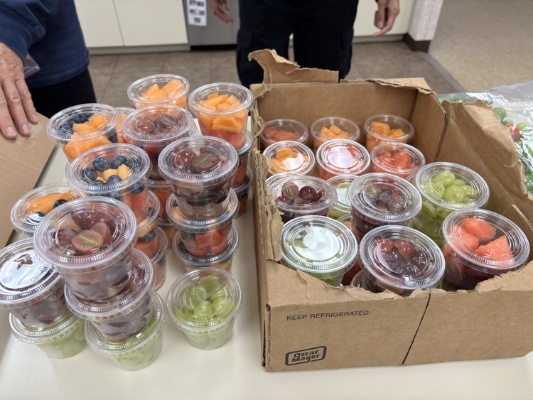 Summit House making Fruit Cups for a local High School's Marching Band's All Aboard Program.