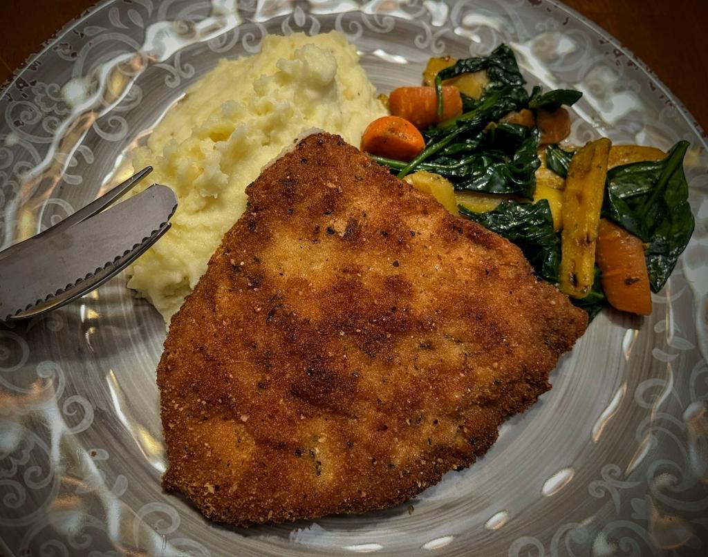 Friday Dinner is Pork Shnitzel, mashed potatoes and hot-honey carrots and spinach