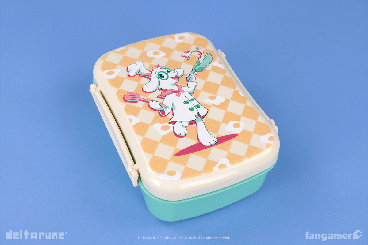 Fangamer's tweet image. Our new DELTARUNE launch features everything you might need to cook for yourself and your friends: A cute bento box, a high-definition Kiss the My Ass apron, and a pair of lounge shorts decorated with little angelic Spamtons.
Available now: fanga.me/r/chefs-choice