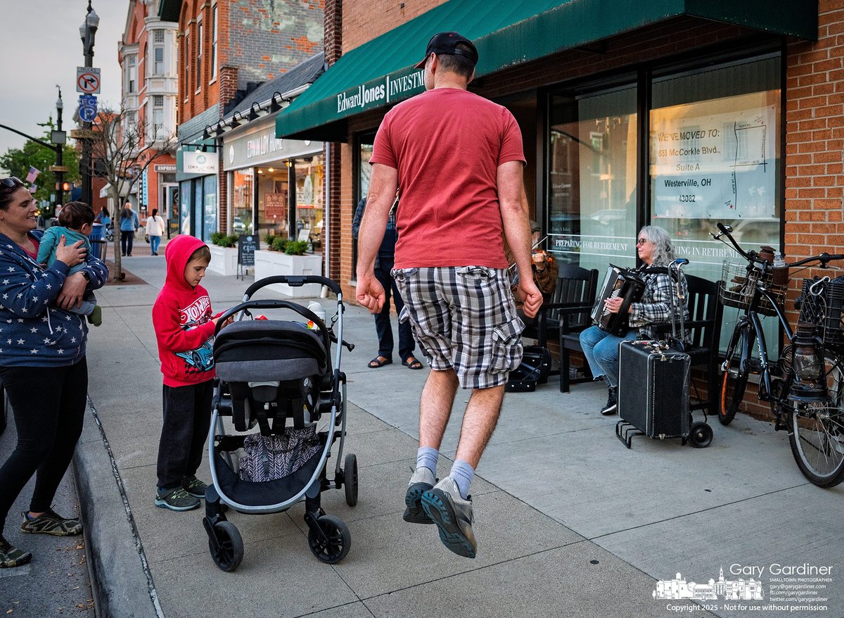 A father dances an Irish jig to the sound of street musicians in Uptown Westerville, delighting his wife and embarrassing his son. 1l.ink/5MHB77G