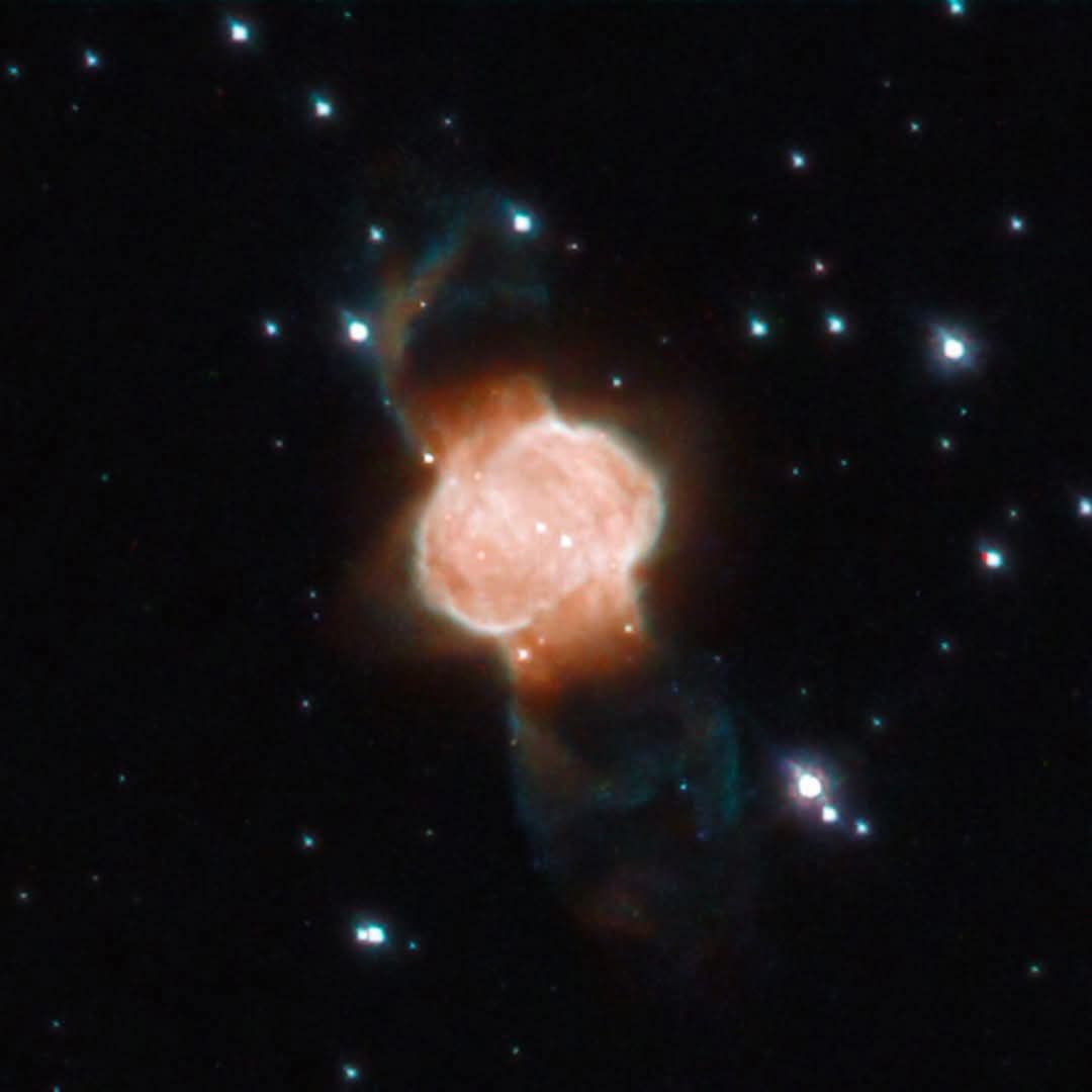 One star dies, birthing a cosmic hourglass : M1-63, a bipolar planetary nebula in Scutum constellation. Formed as a dying star sheds outer layers into gas and dust clouds, shaped by a central binary system channeling material to poles for its hourglass/butterfly