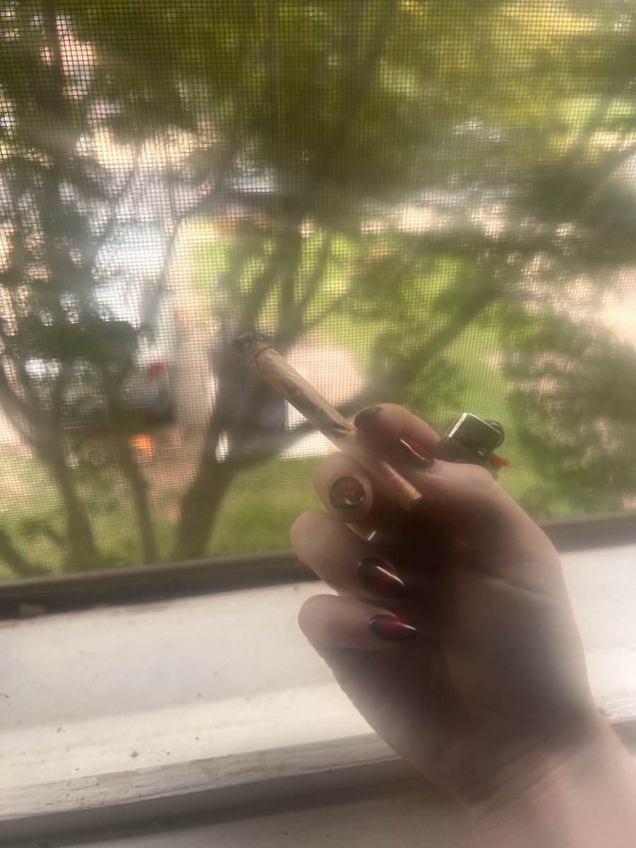 smoking and thought i'd take pictures, but my lense was blury and made it look cool, so of course my high ass took a whole photoshoot of my joint