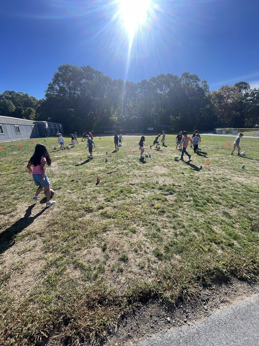 Testing our dribbling skills in week 1 of Soccer