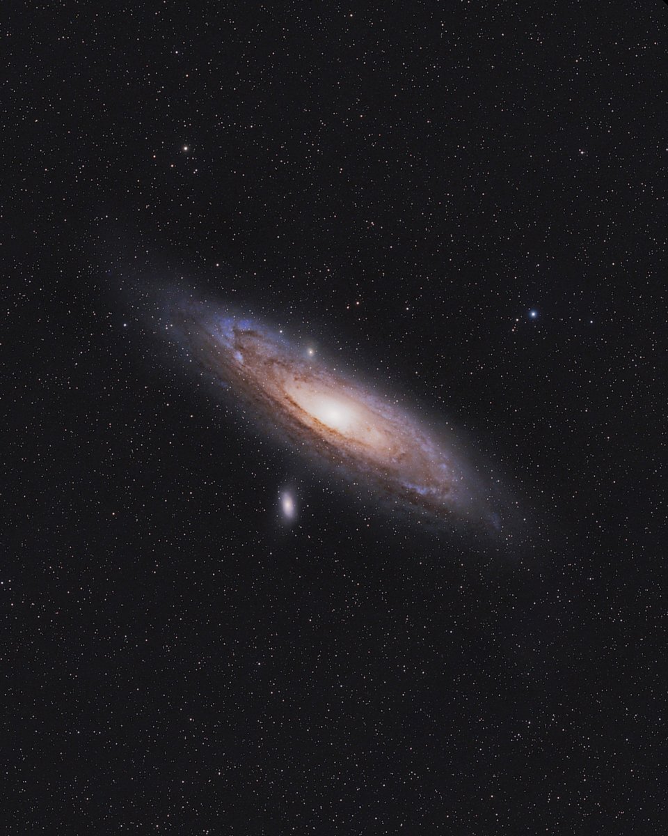 Andromeda Galaxy with a Camera Lens 📷

I took this picture from our campsite last year using my DSLR camera with a telephoto lens attached.

I used a star tracker to compensate for the apparent motion of the night sky, to 'freeze' this galaxy in place for hours.

After 6 years
