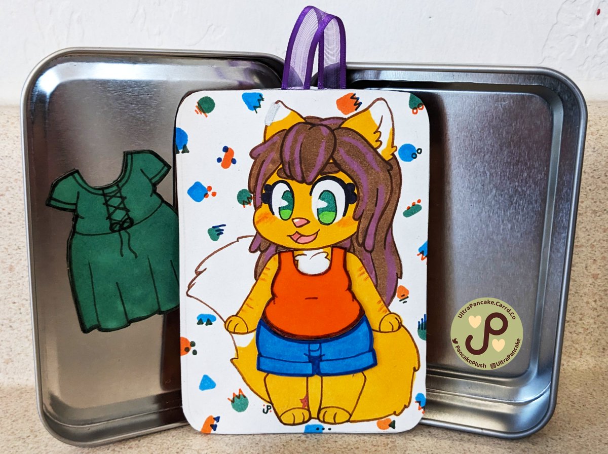 PancakePlush's tweet photo. My friend @Sefris commissioned a magnetic paper doll from me as a gift for her partner @CatKupo! She comes with two outfits and a tin to carry them in!

Art commissions are always open! Check my website for more info:
https://t.co/DAGB76jXA4 

#furry #furryart #paperdoll #cartoon https://t.co/8G80EY4NNg