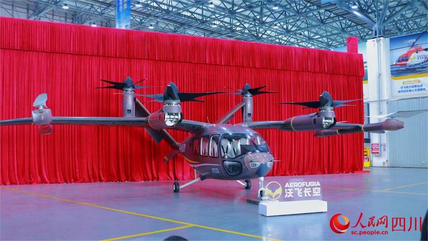 PDChina's tweet image. China’s first homegrown large passenger #eVTOL rolled off the production line in southwest China&apos;s Sichuan on Monday. The 9.9-meter-long, 4.4-meter-tall aircraft has a wingspan of 15 meters, with a flexible 4-to-6-seat cabin, a maximum range of 200 kilometers, and a cruising…