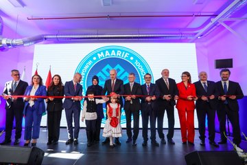 Numan Kurtulmuş and László Kövér standing at a podium with microphones, flanked by Turkish and Hungarian flags. A group of people, including children, cutting a ribbon in front of a Maarif Vakfı logo. Students and adults posing in a classroom with desks and educational materials. An audience seated in chairs at an event with a banner reading "Török-Magyar Innovációs Év 2019".