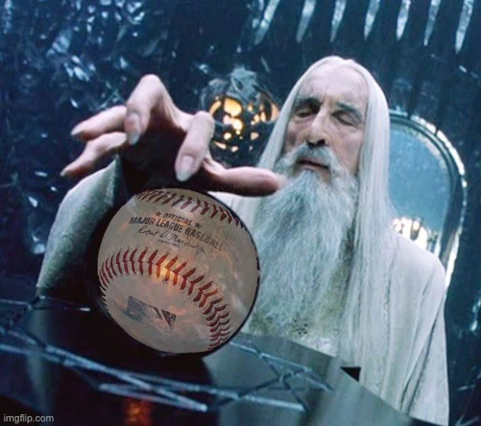 Saruman ponders his orb and finds only baseball