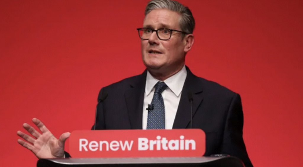 At Labour’s Conference, an unapologetic Keir Starmer announces drastic cuts – traditional three-word slogans are to be slashed by 33%