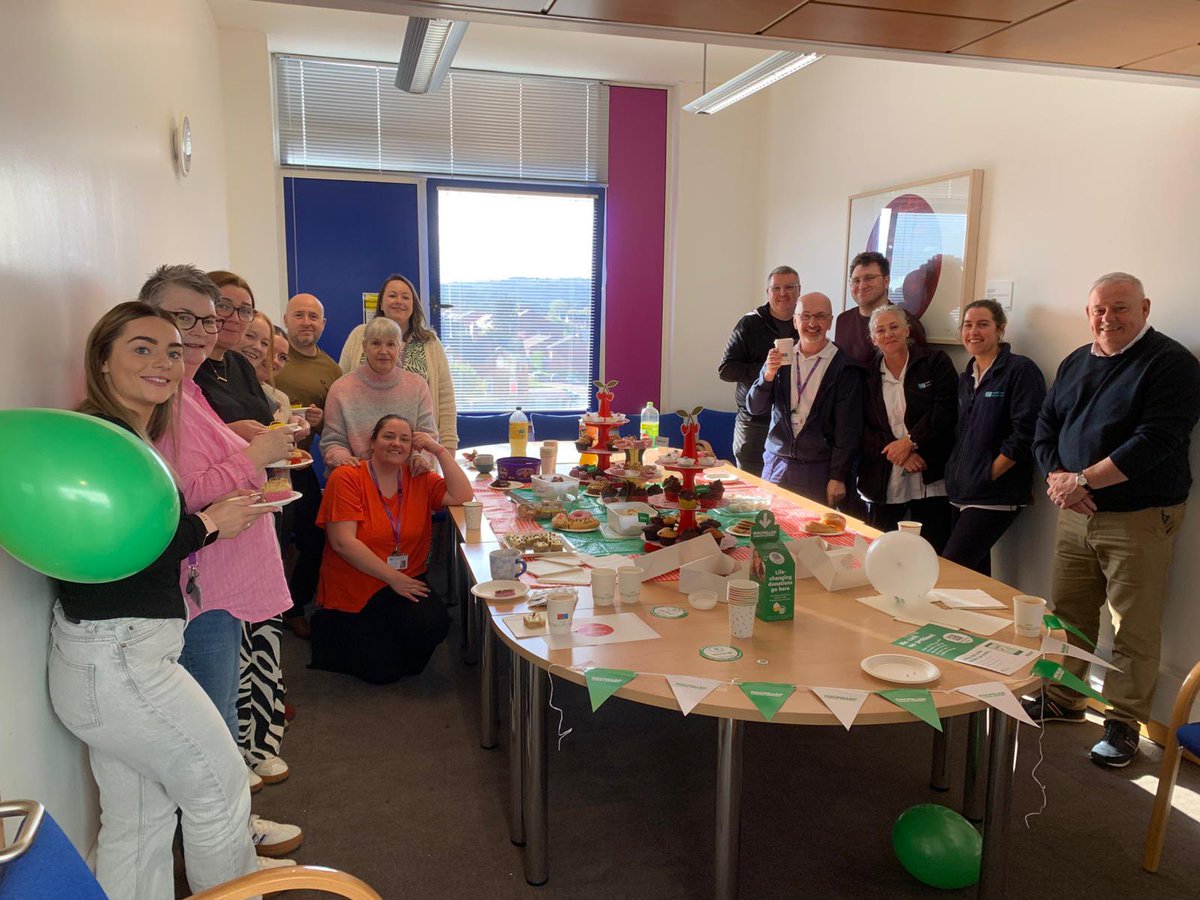 Elizabe70417871's tweet photo. The East Community Social work team pictured with our MDT colleagues doing what we do best, working together and supporting others (and eating cake) ! Incredible amount of money raised last week at our @macmillancancer coffee morning. #BHSCT #proud https://t.co/iQcIrWEX97