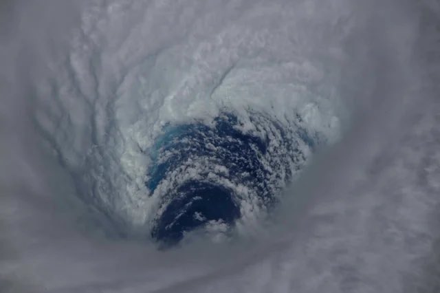 historyinmemes's tweet image. This is the eye of Category 5 Humberto the other night, seen from the International Space Station