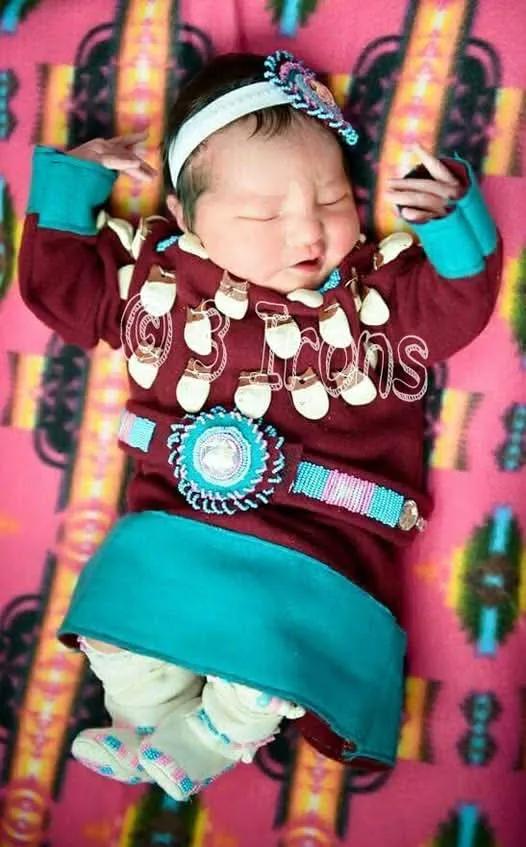My Apsaalooke (Crow) Baby girl born 03/18/2015. She was two days old when this picture was taken at the hospital. I made her Apsaalooke traditional elk tooth dress and Moc's. I made a guess at the size and got it done in two weeks before she arrived. She grew out of it after
