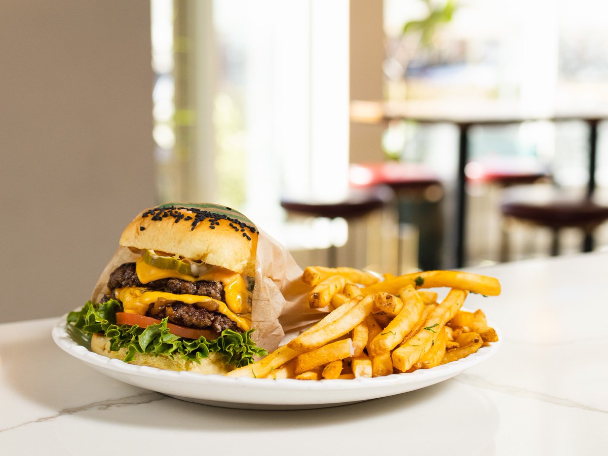 Fully loaded, stacked high, and served with fries—our Double Cheeseburger is the move, no matter the hour. 🍔✨