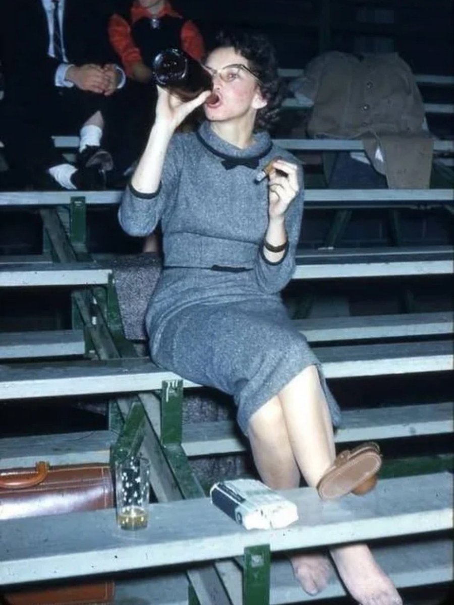 I love her laid back pose (bare foot and all) as she’s drinking booze and smoking a cigar, not giving a care in the world (not easy for a woman to pull off in the 1950s).😀