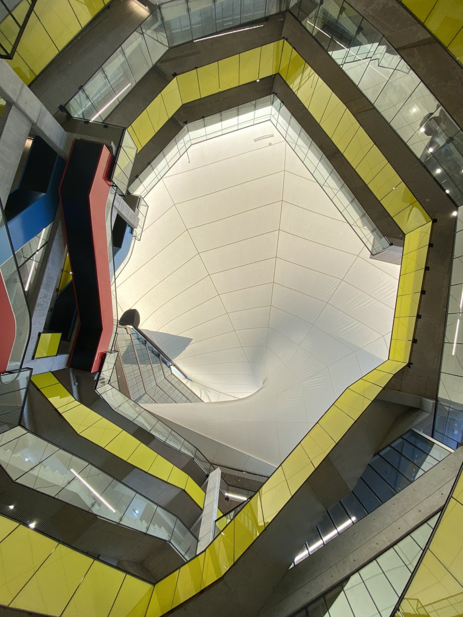 Architizer's tweet photo. This faculty building is organized around a “helical ambulatory,” a spiral ramp linking classrooms and informal learning spaces, with six undergraduate levels below and a six-story tower above.

📍Santiago, Chile
 
By: Marsino Arquitectura
Details: https://t.co/JMVcTX0LYL https://t.co/Dk6NTDoKny