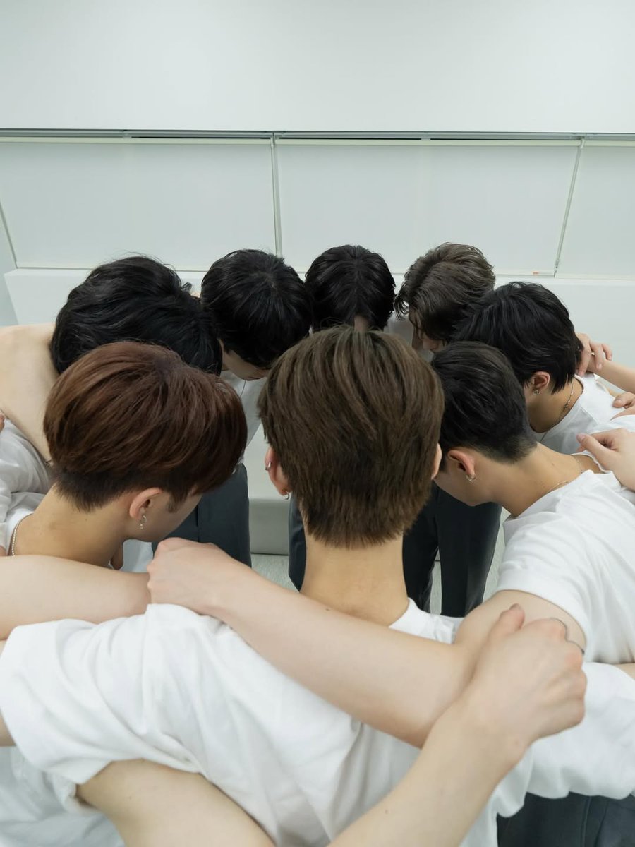 Eight hands reaching toward one dream. Like a compass pointing in every direction, we form a circle that always leads back to one place. From this moment, every note we sing and every step we take will trace the path of a new journey. And this is only the start.