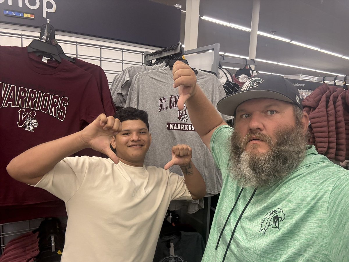 When you are on a late evening trip to Walmart, you see a student from the high school you work at, and there is a perfect backdrop of a rival school…….you take the picture!!!

EEEAAAGGGLLLEEESSS!!!

(They obviously sold out of the Orchard Farm gear already)