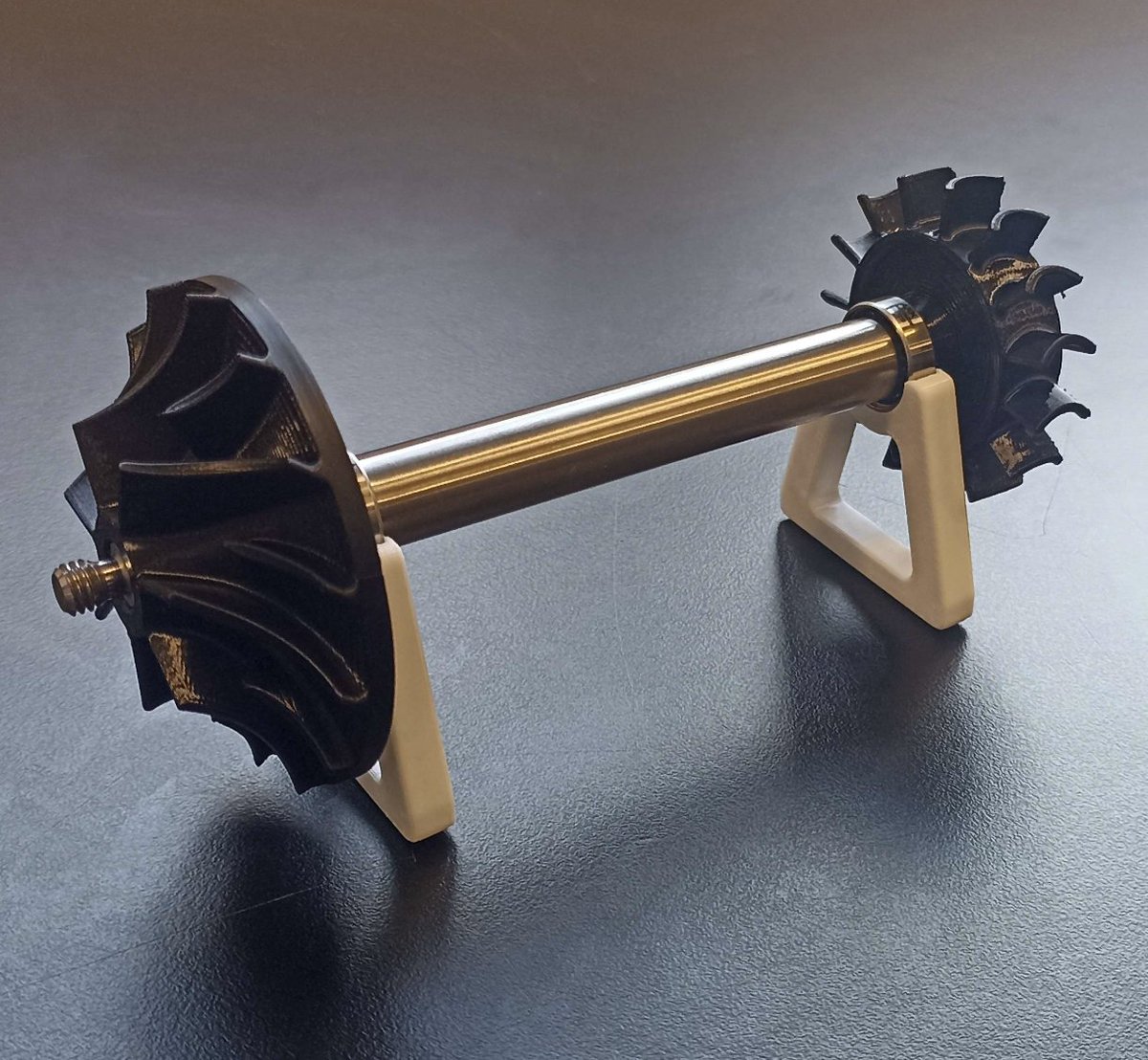 FangSystems's tweet image. Shaft from JLCPCB just arrived!!!

Been printing the parts just to test fitment. All that's left is to finish the combustion chamber and liner.

I've also managed to bump up the thrust to around 45N and dropped the RPM to just above 100,000RPM.

Going to get it manufactured soon!