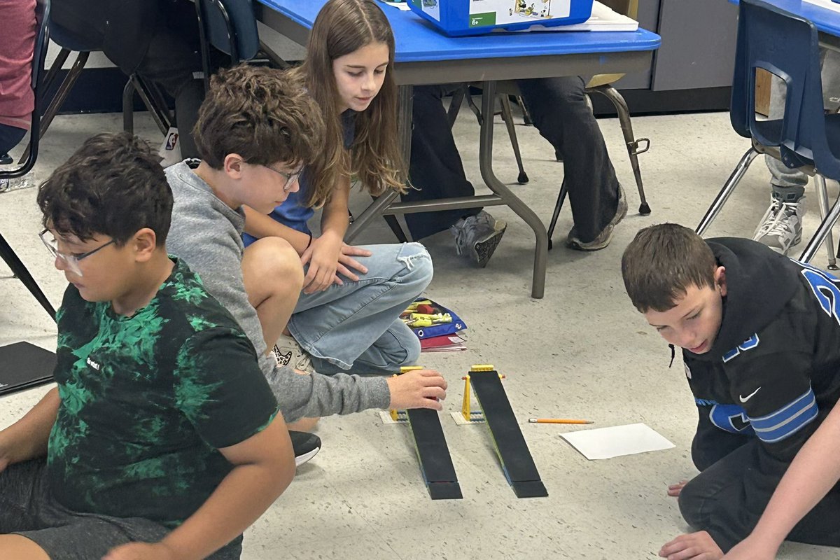 6th Grade STEM Science fun!  Exploring how friction and mass impact how far a car can travel.  Hands-on learning in action!