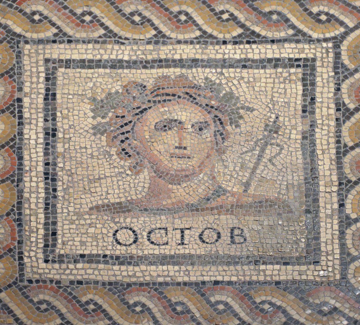 Square panel detail of the Monnus Mosaic with the personification of the month of October (Bacchus with thyrsus and wreath). From a Roman domus in Augusta Treverorum (Trier), late 3rd century AD.

Rheinisches Landesmuseum Trier, Germany.