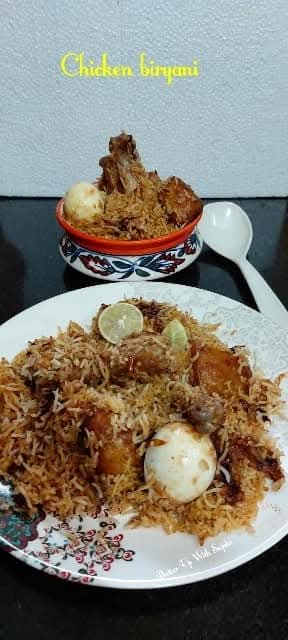 Kolkata style chicken biryani with potato and eggs. This scrumptious biryani is mildly spiced and highly aromatic. Saffron, rose water, Kewra water, meetha attar and aromatic whole spices made this biryani extremely flavorful. batterupwithsujata.com/2021/10/kolkat…